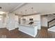 Bright, open kitchen with white cabinets, stainless appliances, and large island at 1099 Gatewick Ct, Greenwood, IN 46143