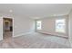 Upstairs loft featuring carpet flooring and natural light with two windows at 1099 Gatewick Ct, Greenwood, IN 46143