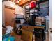 View of an unfinished basement storage area with exposed beams and a door at 5964 Laramie Trl, Columbus, IN 47203