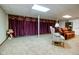 Cozy finished basement featuring a comfortable seating area and unique decorative touches at 5964 Laramie Trl, Columbus, IN 47203