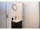 Modern bathroom with a stylish vanity, designer mirror, and a glass-enclosed shower at 5964 Laramie Trl, Columbus, IN 47203