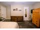Neutral bedroom with traditional wood furniture and doors at 5964 Laramie Trl, Columbus, IN 47203