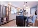 Stylish kitchen features stainless appliances, granite countertops, and a breakfast bar island at 5964 Laramie Trl, Columbus, IN 47203
