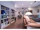 Comfortable living room featuring hardwood floors, built-in bookcases, and modern furniture at 5964 Laramie Trl, Columbus, IN 47203