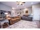 Cozy living room with comfortable seating, a soft rug, and built-in bookcases creating a relaxing atmosphere at 5964 Laramie Trl, Columbus, IN 47203