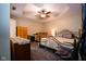 Cozy main bedroom with a ceiling fan, soft lighting, and comfortable furniture at 5964 Laramie Trl, Columbus, IN 47203