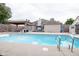 This backyard oasis features a large in-ground pool, cabana, storage shed, and plenty of space for entertaining at 5964 Laramie Trl, Columbus, IN 47203
