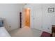 Neutral bedroom with wall-to-wall carpet, a closet and bright windows at 7119 Topp Creek Ct, Indianapolis, IN 46214