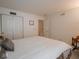 Bedroom with a closet featuring neutral walls, a large bed, and easy access to other rooms at 7119 Topp Creek Ct, Indianapolis, IN 46214