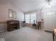 The entryway features a vaulted ceiling, natural light, and decorative touches, exuding a welcoming ambiance at 7119 Topp Creek Ct, Indianapolis, IN 46214