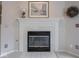 Elegant fireplace with white mantel, decorative tile surround, and black firebox at 7119 Topp Creek Ct, Indianapolis, IN 46214