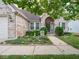 Brick home with manicured lawn, garden and walkway at 7119 Topp Creek Ct, Indianapolis, IN 46214