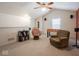 Open game room with ample space, featuring comfortable seating and foosball table for Gathering entertainment at 7119 Topp Creek Ct, Indianapolis, IN 46214