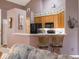 The kitchen features wooden cabinets, black appliances, and a breakfast bar, creating a functional space at 7119 Topp Creek Ct, Indianapolis, IN 46214