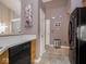 Features a dishwasher and a full size refrigerator with tile flooring and painted walls at 7119 Topp Creek Ct, Indianapolis, IN 46214