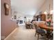 Open concept living area with fireplace, dining area, and bar seating at 7119 Topp Creek Ct, Indianapolis, IN 46214