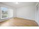 Bright bedroom featuring hardwood floors and a window for natural light at 236 Bixler Rd, Indianapolis, IN 46227