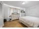 Bedroom with bright windows and a dresser with mirror at 236 Bixler Rd, Indianapolis, IN 46227