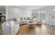 Bright living room featuring a neutral color scheme, hardwood floors, and a large window overlooking the outdoors at 236 Bixler Rd, Indianapolis, IN 46227