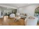 Spacious living area offering hardwood floors, comfortable seating, and a view into the adjacent dining space at 236 Bixler Rd, Indianapolis, IN 46227