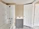 Bathroom with tub/shower and gray vanity at 1011 S Elm St, Muncie, IN 47302