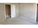 Well-lit bedroom with closet and access to another room at 1011 S Elm St, Muncie, IN 47302