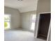 Spacious bedroom with two windows and a closet at 1011 S Elm St, Muncie, IN 47302