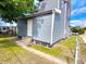 Side view of house, showcasing gray siding and landscaping at 1011 S Elm St, Muncie, IN 47302
