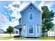 Two-story house with blue siding, front porch, and landscaping at 1011 S Elm St, Muncie, IN 47302