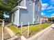 House exterior with gray siding and small yard at 1011 S Elm St, Muncie, IN 47302