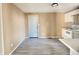 Kitchen with white cabinets, mosaic backsplash, and flooring at 1011 S Elm St, Muncie, IN 47302