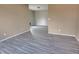 Spacious living room with grey wood-look flooring at 1011 S Elm St, Muncie, IN 47302