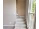 Gray carpeted stairs leading to the second floor at 1011 S Elm St, Muncie, IN 47302