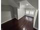 Bright bedroom with hardwood floors, neutral walls, and a sunny window view at 2869 Stuart St, Indianapolis, IN 46218