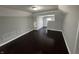 Bedroom featuring hardwood floors and neutral walls with an adjoining room at 2869 Stuart St, Indianapolis, IN 46218