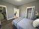 A gray bedroom features wood floors, a closet, and an ensuite bathroom at 2869 Stuart St, Indianapolis, IN 46218