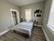 Serene bedroom with neutral tones, ample natural light, and a spacious closet at 2869 Stuart St, Indianapolis, IN 46218