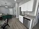 Modern kitchen featuring white cabinets, stainless steel appliances, and views to the living space at 2869 Stuart St, Indianapolis, IN 46218