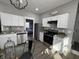 Modern kitchen featuring white cabinets, stainless steel appliances, and granite counters at 2869 Stuart St, Indianapolis, IN 46218