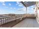 Private tiled balcony offers outdoor living space with railings and a view of the surrounding city at 1155 S Rangeline Rd # 505, Carmel, IN 46032