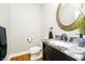 Modern half bathroom with granite countertop, and stylish fixtures at 13668 Cheswick Blvd, Carmel, IN 46032