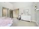 Spacious bedroom features a dresser, carpet, and walk-in closet at 13668 Cheswick Blvd, Carmel, IN 46032