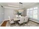 Formal dining room with stylish chandelier, and ample natural light at 13668 Cheswick Blvd, Carmel, IN 46032