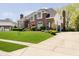 Charming brick house with green lawn, landscape, and driveway at 13668 Cheswick Blvd, Carmel, IN 46032