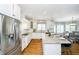 Gourmet kitchen with stainless steel appliances, granite countertops, and ample counter space at 13668 Cheswick Blvd, Carmel, IN 46032