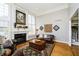 Spacious living room features a fireplace, hardwood floors, and large windows at 13668 Cheswick Blvd, Carmel, IN 46032