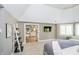 Spacious main bedroom showcasing a sitting area, plush carpeting, and an ensuite bathroom at 13668 Cheswick Blvd, Carmel, IN 46032
