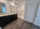 Well-lit bathroom featuring double sinks, a glass-enclosed shower, and modern fixtures at 3202 W Longbranch Dr, Monrovia, IN 46157