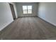 Comfortable bedroom featuring soft carpeting, white walls, and a window, offering a peaceful retreat at 3202 W Longbranch Dr, Monrovia, IN 46157