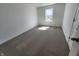 Cozy bedroom with soft carpet, white walls, and a window providing natural light, creating a comfortable atmosphere at 3202 W Longbranch Dr, Monrovia, IN 46157